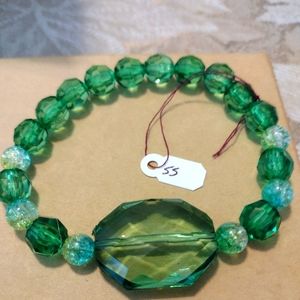 Artemis's Gems custom-made beaded bracelet with large green gem